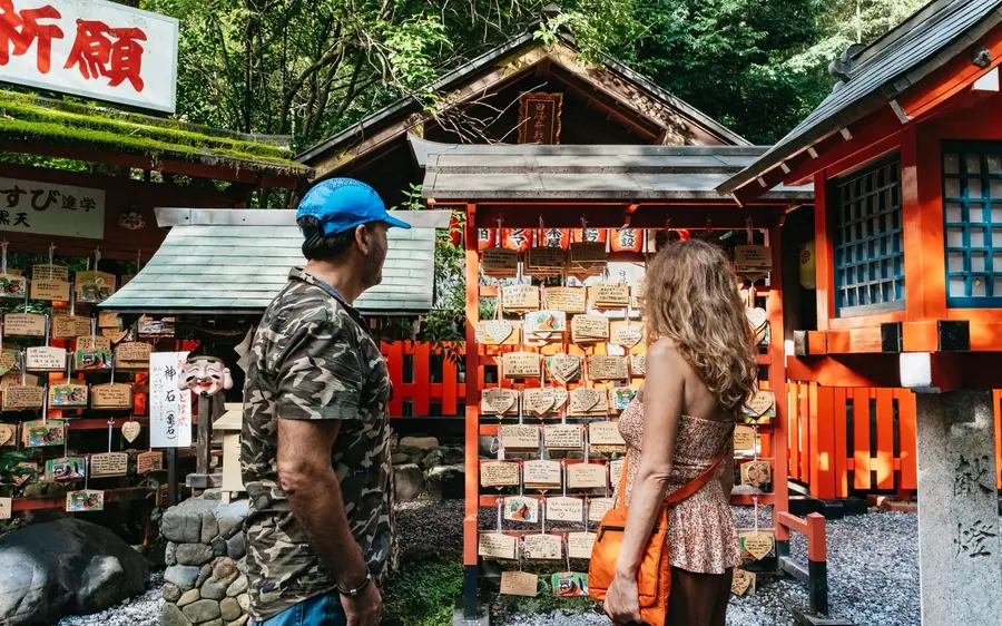 Wooden ema plaques hanging at a shrine on Mount Inari